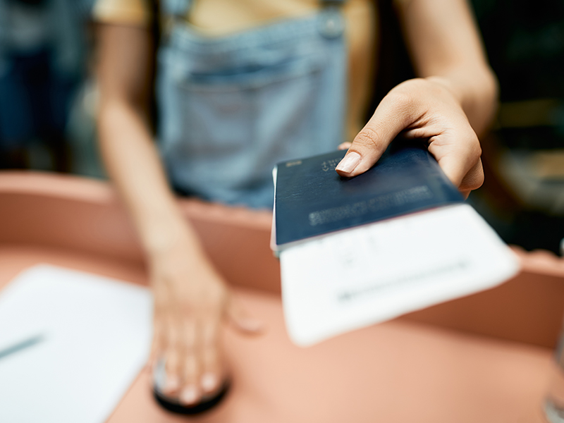 Person Handing Documents