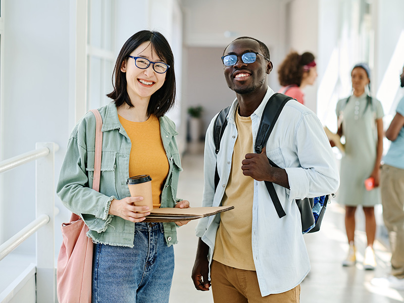 Two students standing next to each other