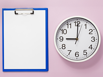 Image of a clipboard and clock